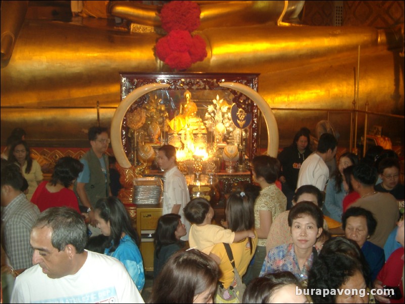 At the base of Phrachao Phananchoeng, the golden Buddha inside Wat Phananchoeng.