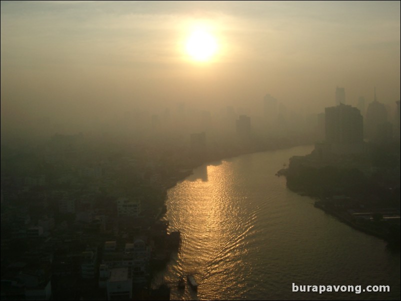 Early morning skyline views of Bangkok from Samphanthawong. Chao Phraya River below.