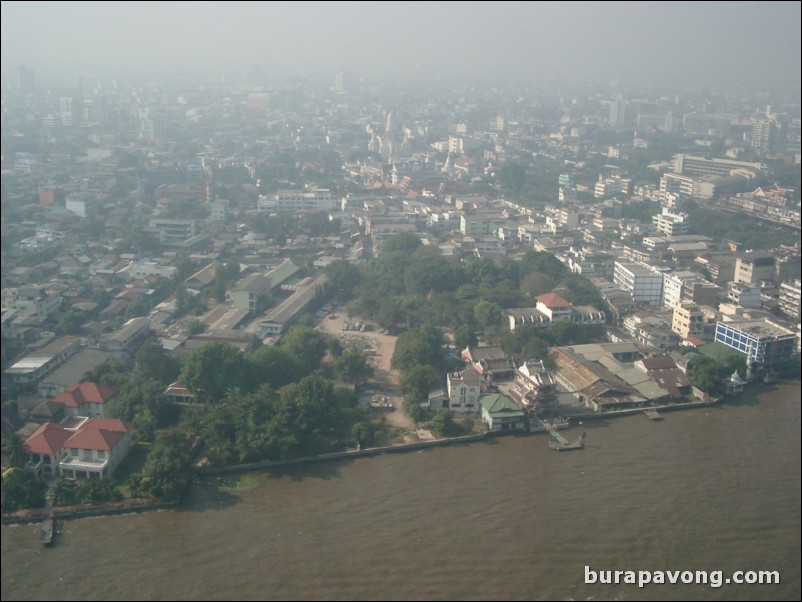 Early morning skyline views of Bangkok from Samphanthawong. Chao Phraya River below.