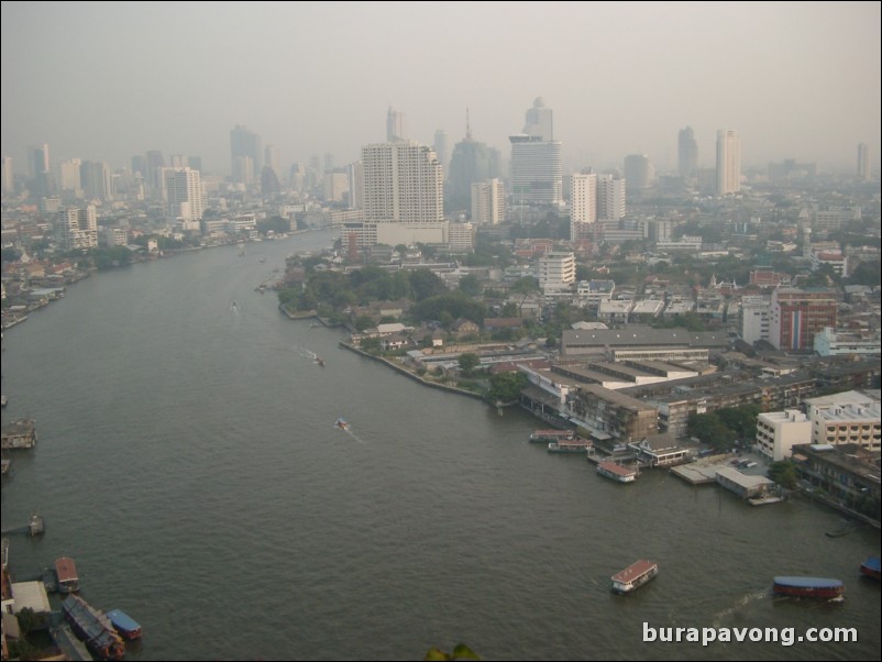 Afternoon skyline views of Bangkok from Samphanthawong. Chao Phraya River below.