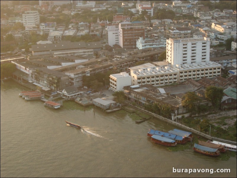 Aerial views of Bangkok from Samphanthawong. Chao Phraya River below.