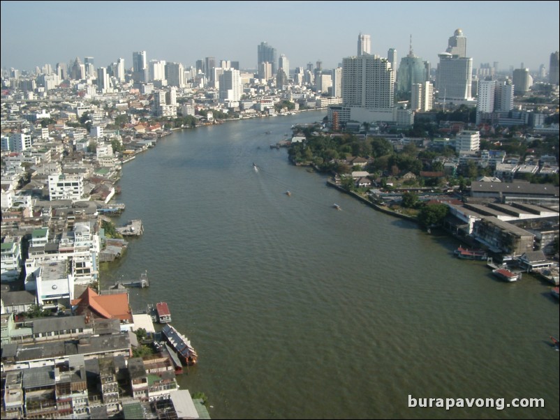 Aerial views of Bangkok from Samphanthawong. Chao Phraya River below.