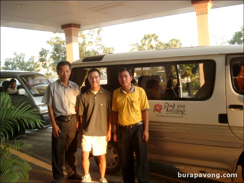 Left to right: Driver, me, and guide with our van.