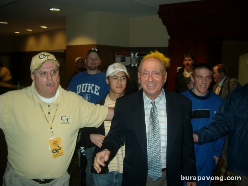 A great picture of me stalking Dick Vitale as he is escorted outside the coliseum.