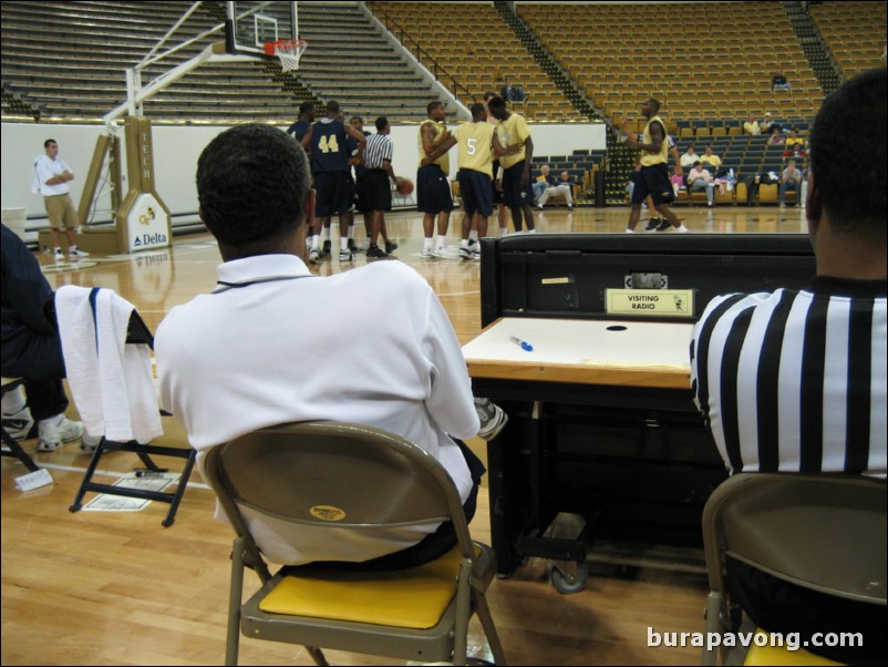 Coach Hewitt watching the scrimmage from the scorer's table.