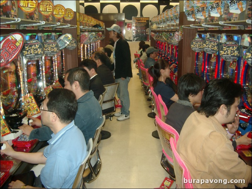 People playing pachinko.