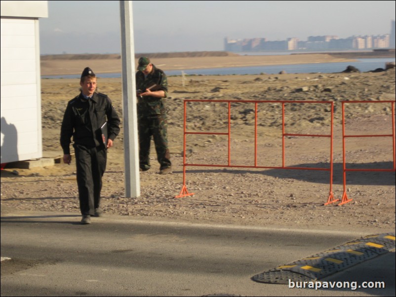 Guards control traffic into and out of the pier.