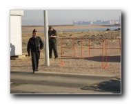 Guards control traffic into and out of the pier.